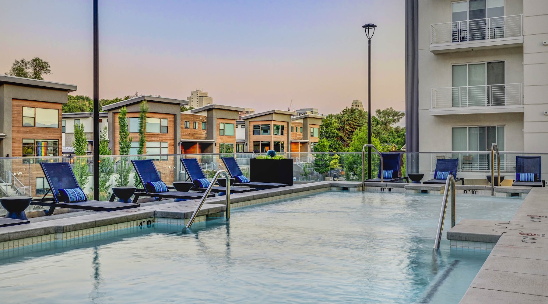 Relax and unwind poolside resort style pool with seating